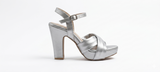 Silver high-heeled shoe on a white background